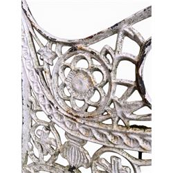 Pair of ornate painted cast iron bench ends, painted in white finish