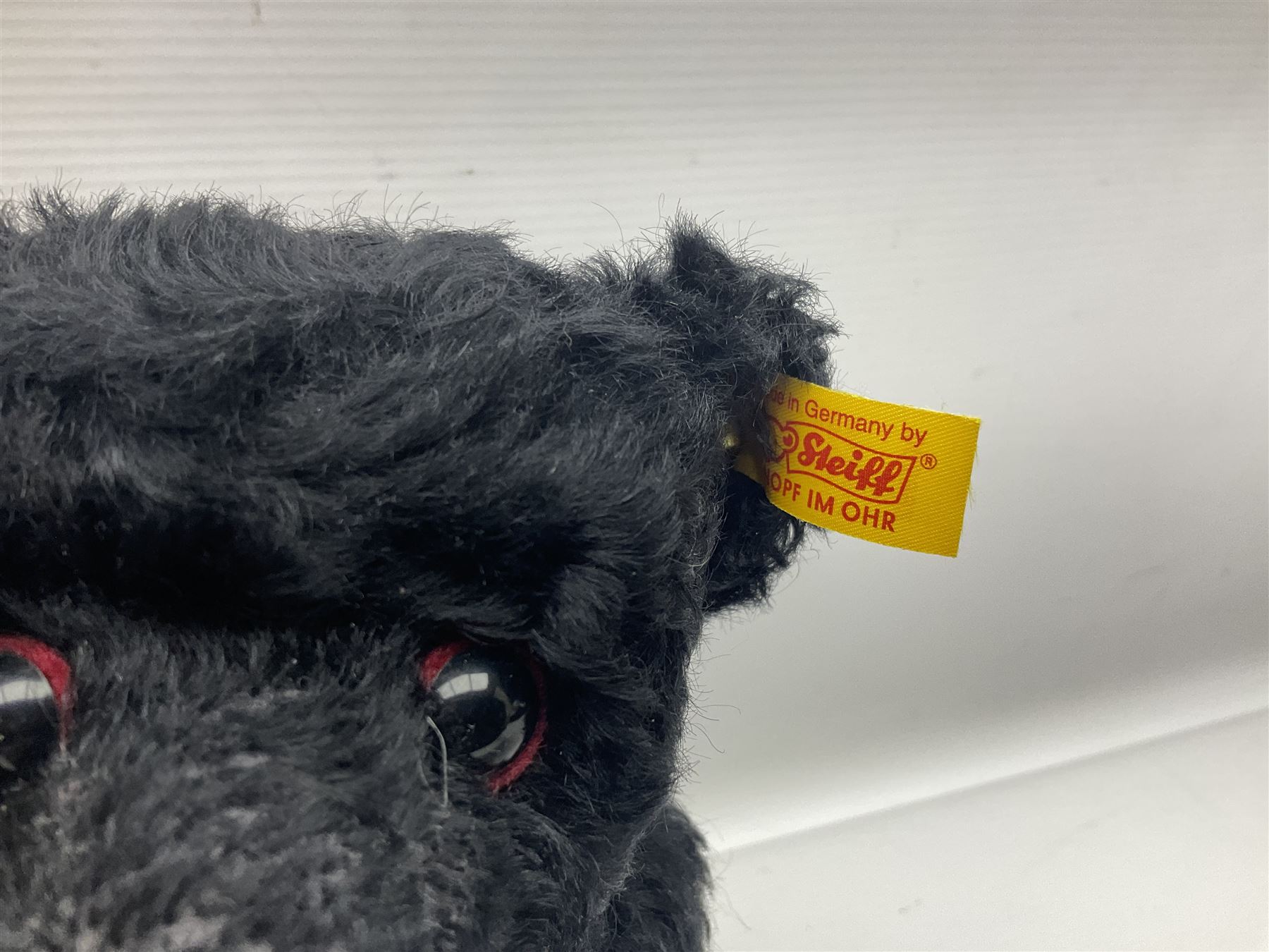 Seven modern Steiff teddy bears comprising two limited edition '1908 Paul the Growler' bears Nos.1124/3000 and 1310/3000; 028649 Classic Teddybear 23; 005992 Classic Teddybear 28 (black); 071249 Mungo Meerkat 30; 079139 Reclining dog for American Kennel Club; and 029561 Petsy gespitzt (1928) 16cm; together with a Mrs. McCatty's limited edition 2156 Sophie bear No.1557/1750; all unboxed but most with labels (8)