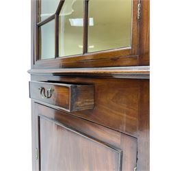 George III mahogany floor standing corner display cabinet, dentil cornice, upper astragal glazed door above small drawer and lower cupboard, on bracket feet, in two sections
