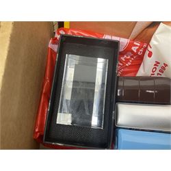 Mostly Queen and Freddie Mercury interest items, including pin badges, newspaper cuttings, diecast 'promotional' vehicles, special edition Pop Rocks figure of Freddie Mercury, VHS tapes, two charity certificates signed by Brian May and Roger Taylor, poster etc, in two boxes 