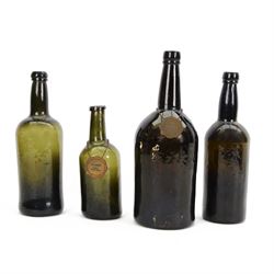 Four 18th/19th century green glass wine bottles, with two labels, Port Early 18th cent. an...