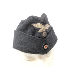  WW2 German Luftwaffe side cap, blue wool with embroidered other ranks pattern eagle and cockade, blue cloth lined interior  