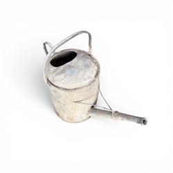 19th century milk churn with weathered patina along with aluminium watering can