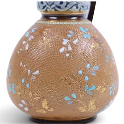 Pair of Doulton Lambeth ewers, decorated with a lace-impressed body decorated with floral sprigs, H16cm