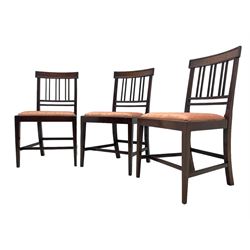 Early 20th century Regency design mahogany tilt-top table, circular top with edge banding, supported by a central turned pedestal with four reeded sabre supports terminating in castors; six chairs with pink upholstered drop in seats (7)