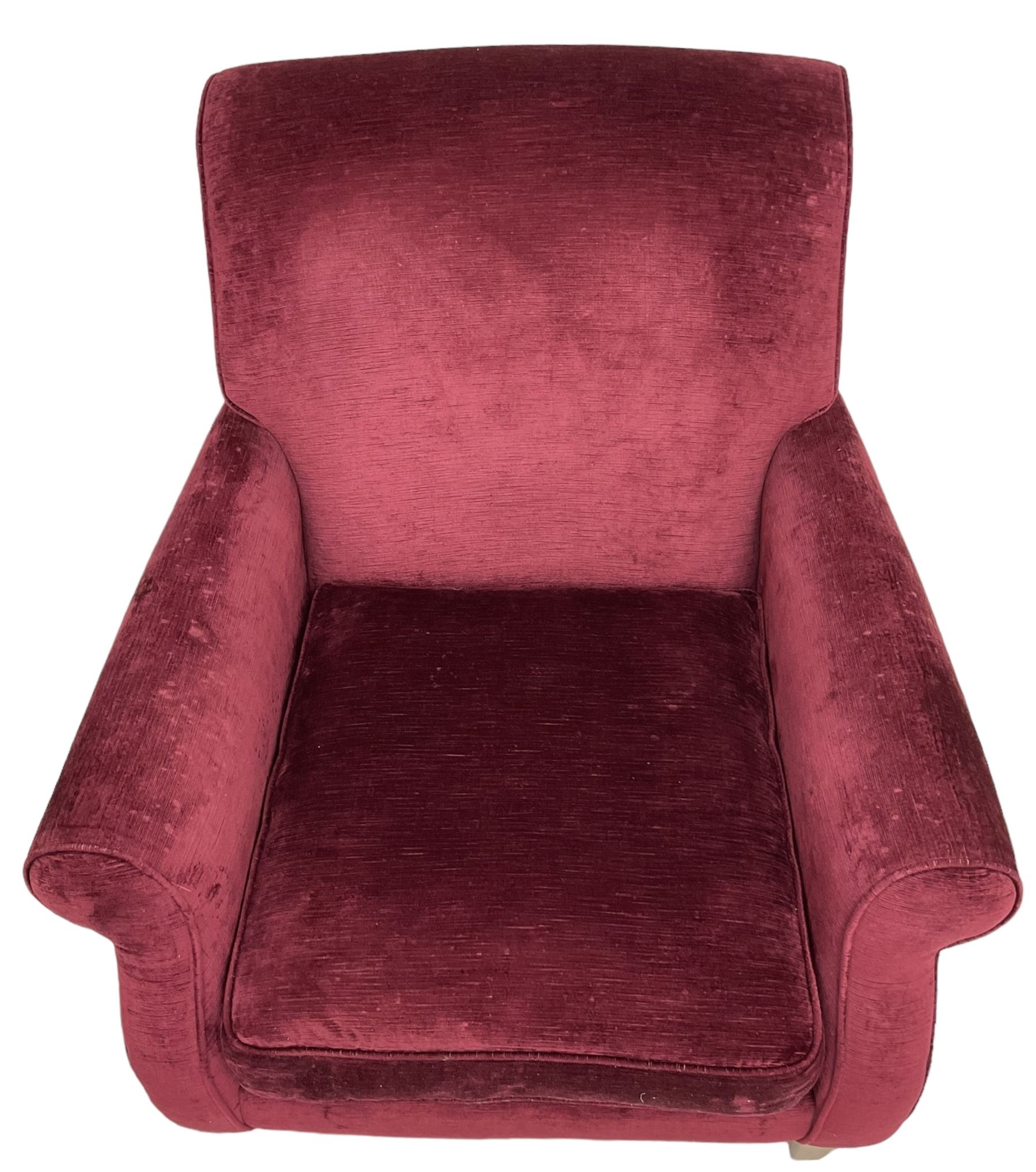 Duresta - traditional shape armchair upholstered in burgundy red velvet, on square tapering front supports (W88cm, H85cm, D103cm); together with a matching rectangular footstool with hinged seat, on turned feet with brass castors (73cm x 54cm, H38cm)