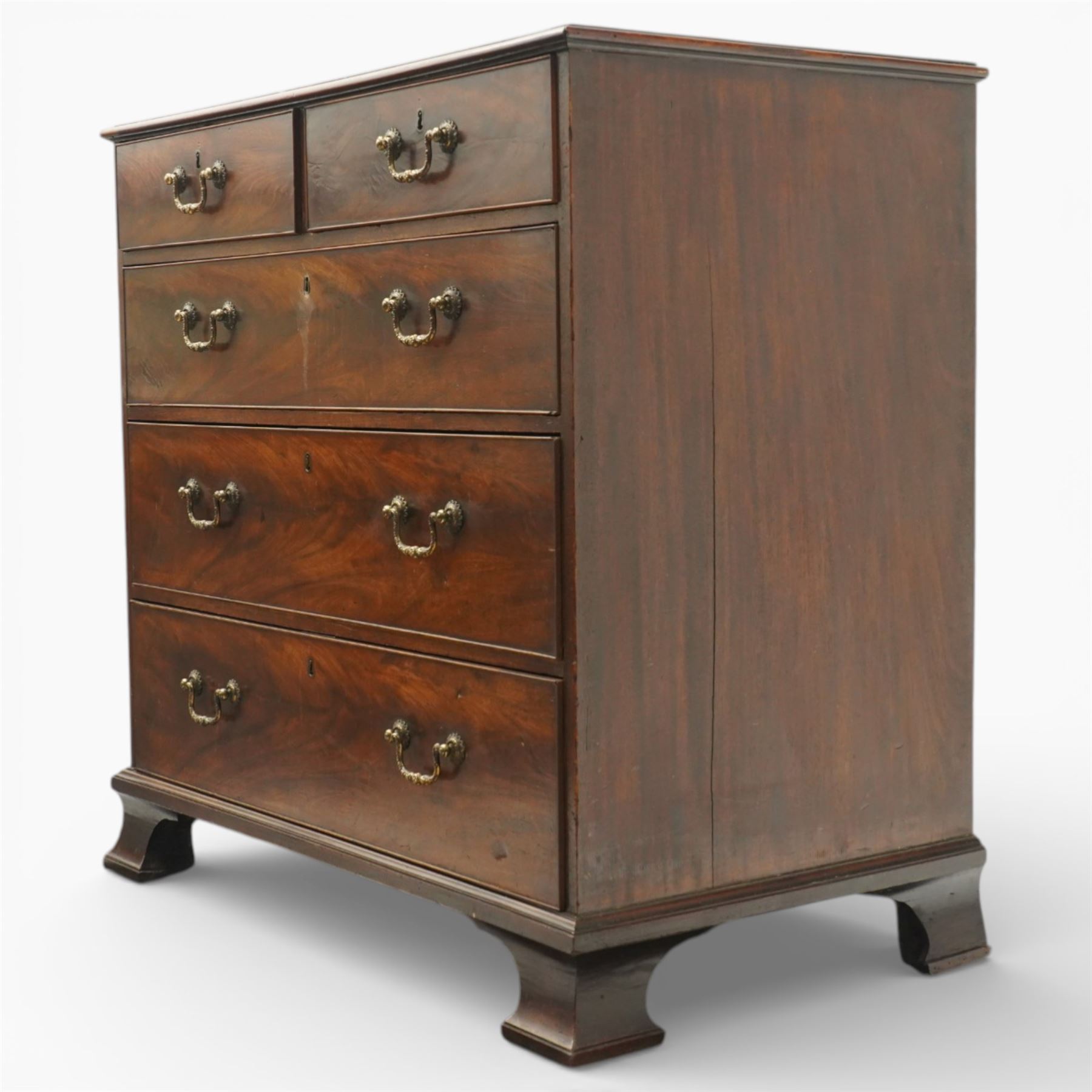 18th century Chippendale style mahogany chest of drawers, the moulded rectangular top above two short and three long drawers fitted with brass swan neck handles, raised upon original shaped bracket feet