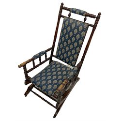 Early 20th century turned beech American rocking chair, upholstered seat, back and arms