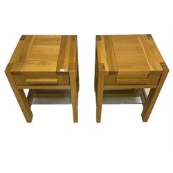 Pair of solid light oak lamp tables, fitted with single drawer and glass under-tier