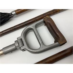 Early 20th century curved horn handle walking stick with hallmarked silver mounts, engraved L Russell 1918, together with a shooting stick by William Mills Birmingham, with leather handle, 'The Featherwaite' shooting stick and an umbrella with wooden handle