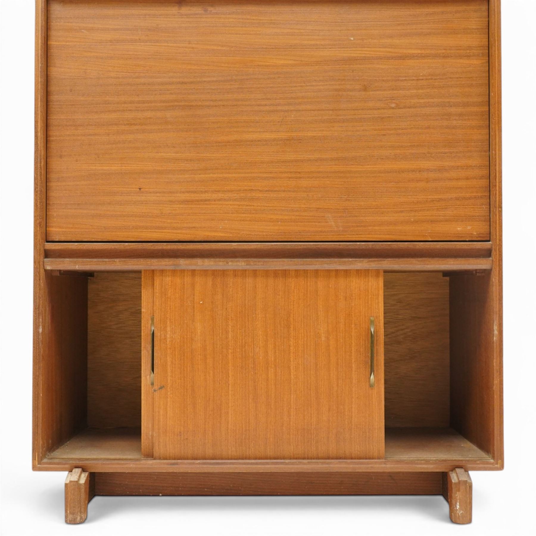 Robert Heritage (1927-2008) for Beaver & Tapley - Mid 20th century teak bureau, fall front with fitted interior, above a sliding door cabinet, raised on short supports