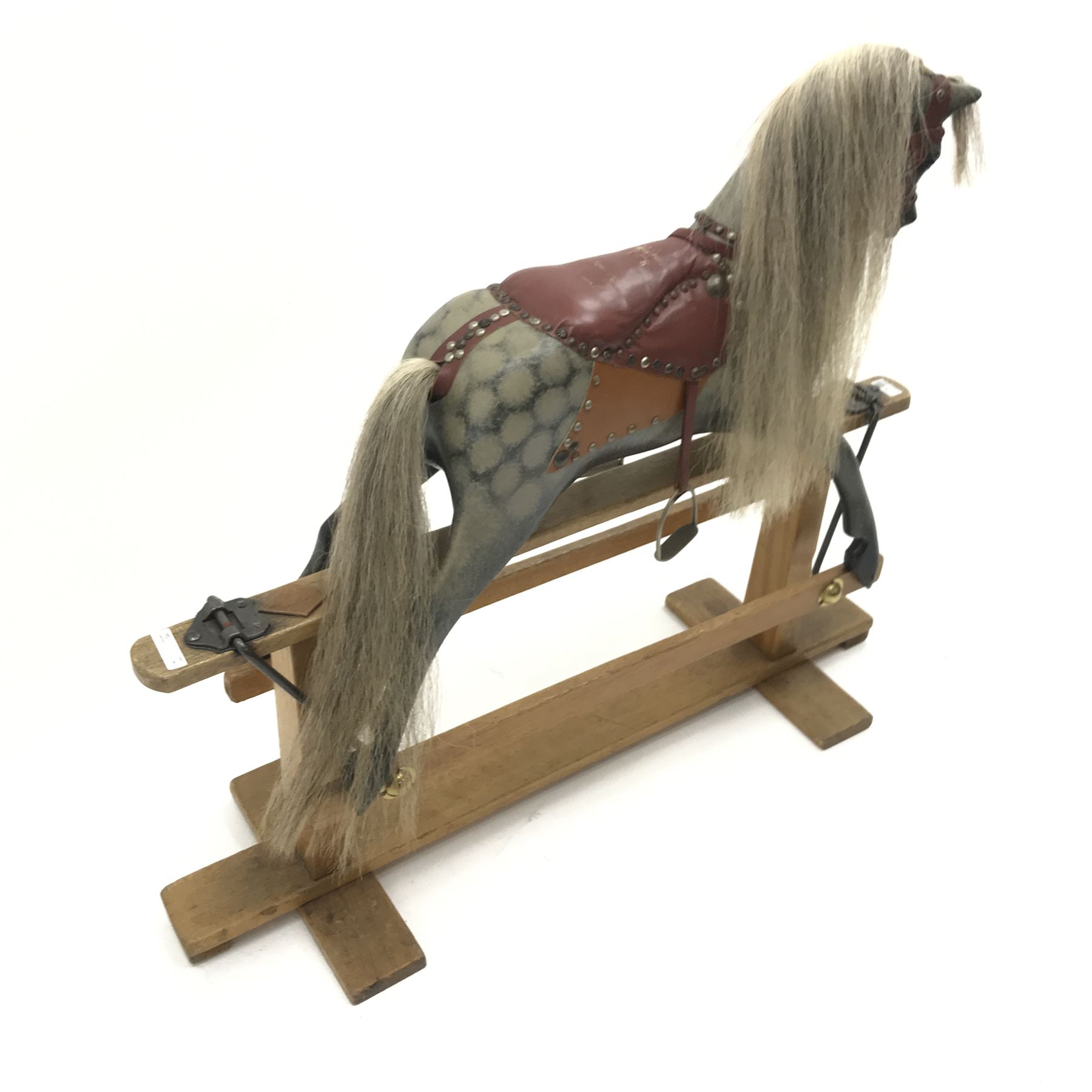 Early 20th century dapple grey rocking horse, leather rein and saddle