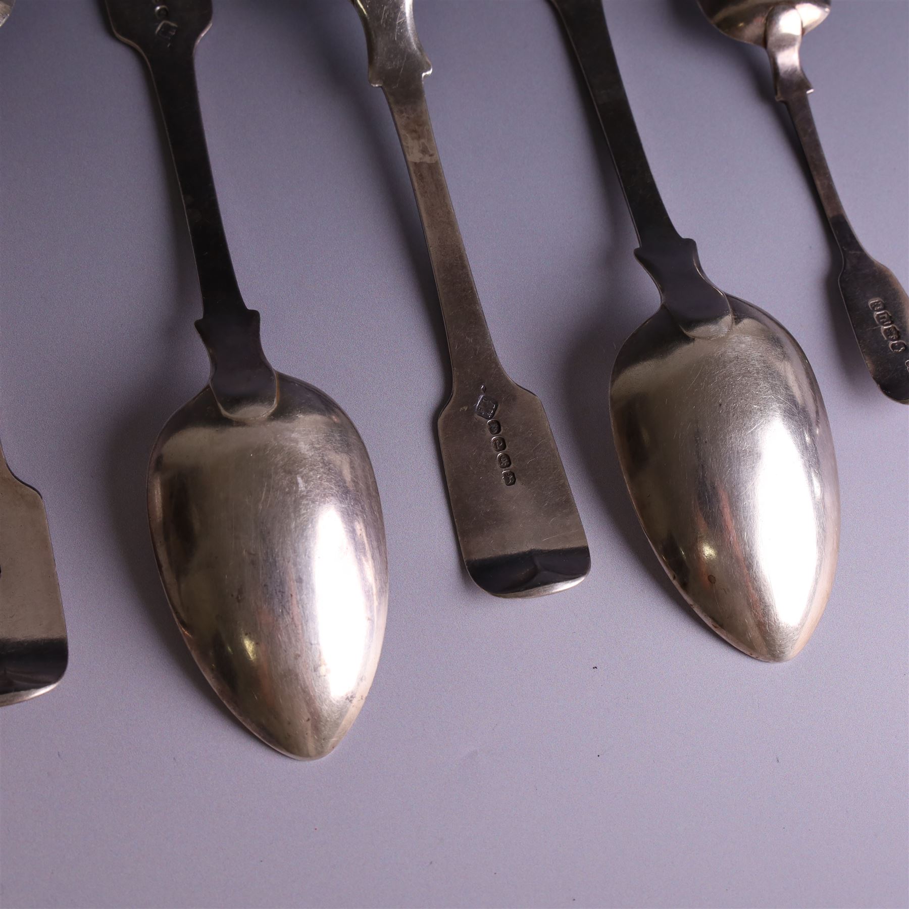 Set of four George III silver Fiddle pattern table spoons all engraved with monogram, hallmarked Thomas Wallis (II) & Jonathan Hayne, London 1819, together with a  Victorian silver Fiddle pattern teaspoon with engraved initials, hallmarked William Rawlings Sobey, Exeter 1846