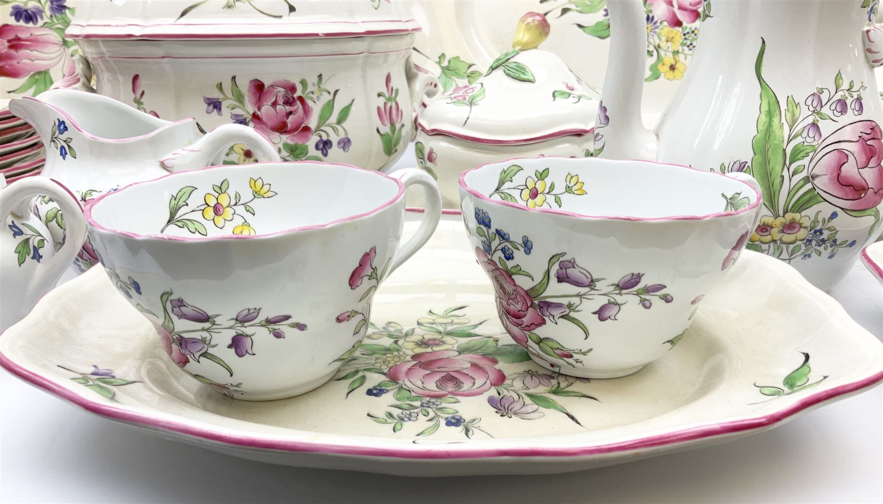 Matched Copeland Spode, Spode and French Luneville and Marlborough Sprays pattern dinner and tea wares, comprising two tureen and covers and apple finials, two sauce tureen and covers with pear finials and fixed stands, six graduated platters including two pairs, large plate, thirteen dinner plates, twelve bowls, ten smaller bowls, eight side plates, eleven smaller side plates, teapot, twin handled sucrier and cover with apple finial, open sucrier, cream jug, smaller cream jug, four breakfast cups, eight tea cups, four large saucers, eleven smaller saucers, and nine further smaller saucers. 