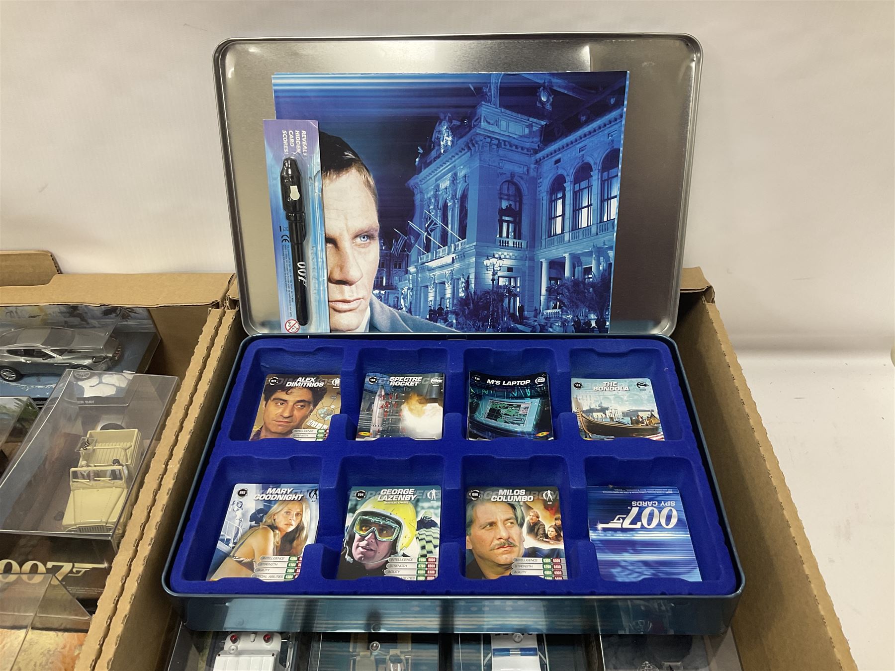 Fabbri James Bond Collection - over one hundred and ten die-cast models in perspex display cases as issued periodically; and a quantity of associated magazines and trading cards, in five boxes