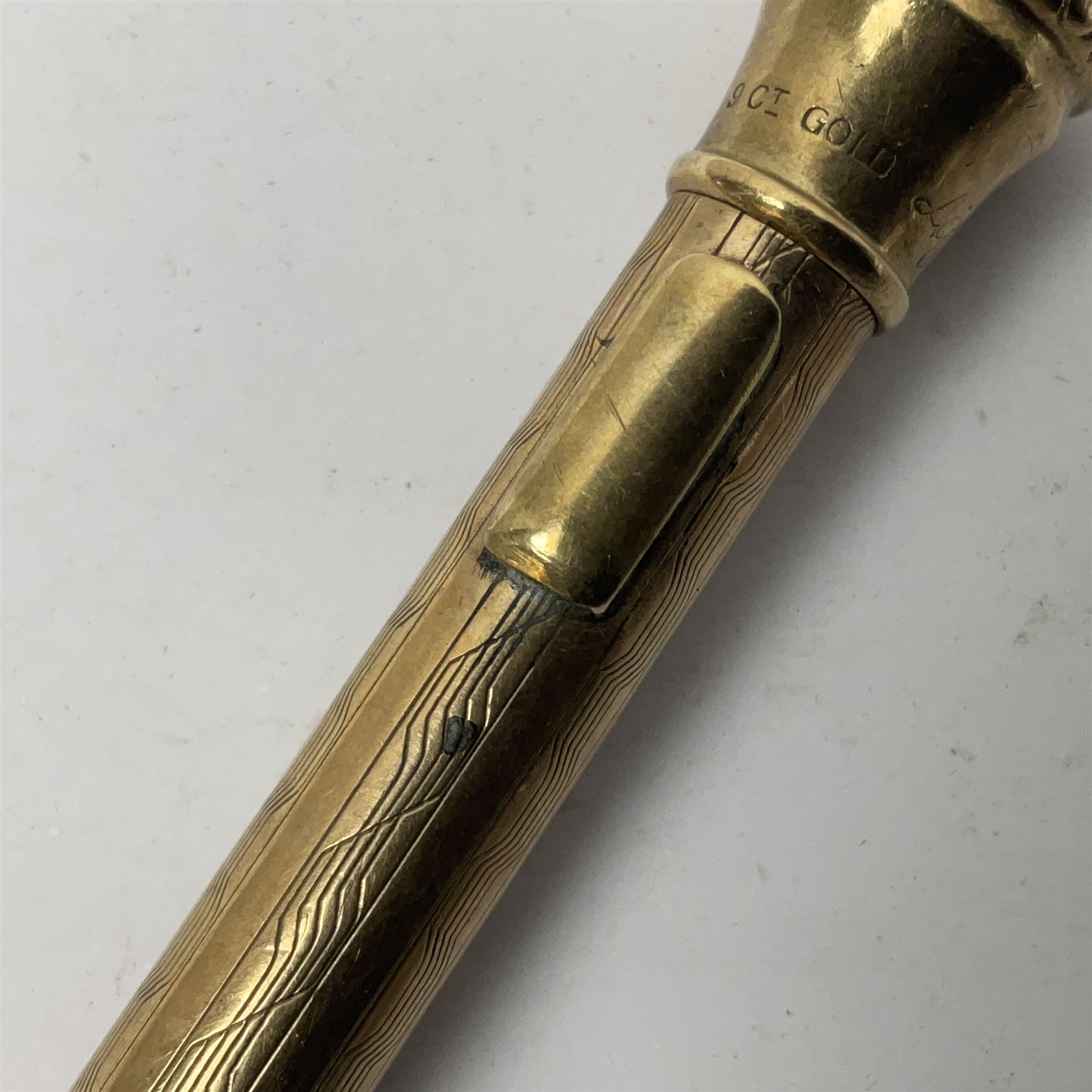 9ct gold 'Lifelong' propelling pencil, with engine turned decoration, stamped 9ct 