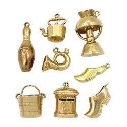 Seven 9ct gold charms including bucket, horn, ten-pin bowl, clog and horn, all hallmarked and a 14ct gold clog charm