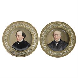 Pair of late 19th century English porcelain hand painted portrait plaques, each of circula...