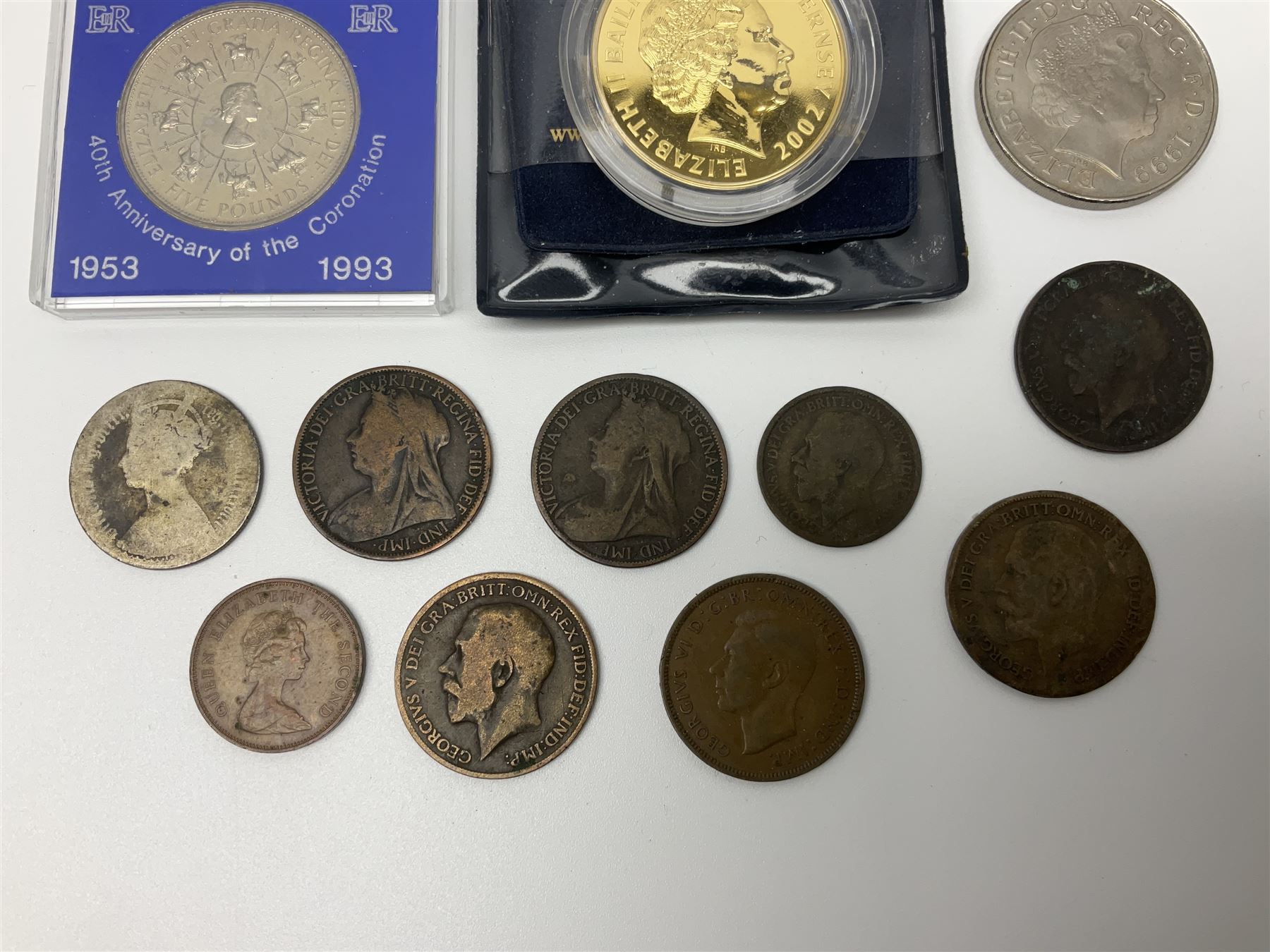 Two Great British Queen Elizabeth II five pound coins and a small number of other coins
