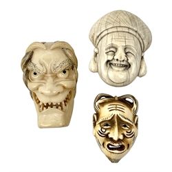 Group of three Japanese Meiji carved ivory mennetsuke/mask netsuke, comprising Hannya mask, Noh mask, and Hotei mask, H5cm, (3)   
