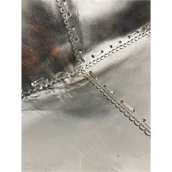 Metal framed butterfly chair upholstered in slung dark tan stitched leather 
