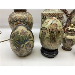 Two 20th century Japanese Satsuma ceramic eggs, decorated with flowers, figures and gilt, together with two Satsuma lamps in the form of ginger jars, cylindrical jar and cover of octagonal form, H25cm, and other Chinese and Japanese ceramics to include lidded boxes, plates and bowls etc with various character marks beneath