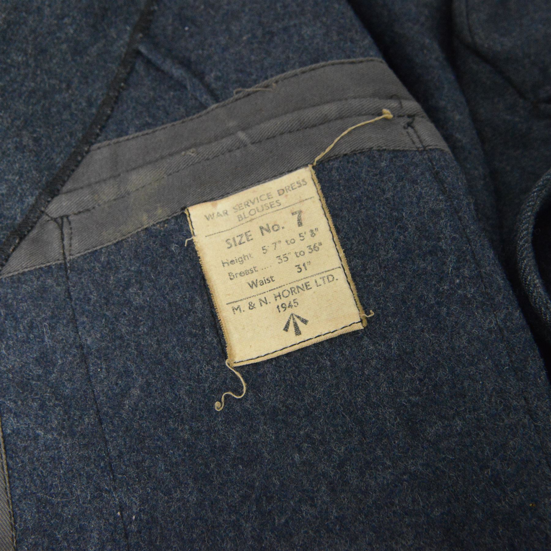 WWII Royal Air Force battle dress blouse, belonging to Flight Sargent Colin Scott 3011422, dated 1945, tailors label for M & N Horne Ltd 1945, Size No 7, blue cloth, Signaller cloth brevet, wireless officers patch to right sleeve and braid sergeant stripes to both sleeves, together with his flight log book, postings & Movements, Royal Air Force Service and Release Book, photographs etc  