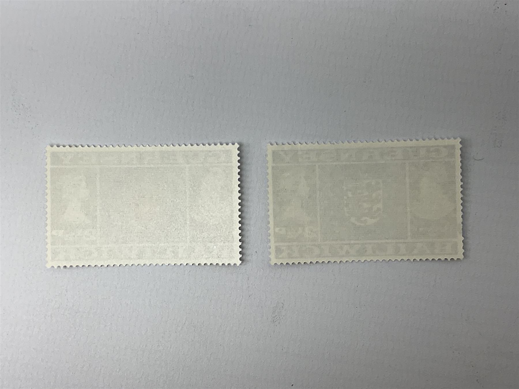 Error stamp, Queen Elizabeth II Bailiwick of Guernsey 2 1/2p stamp with colour omission on the shield, with the standard issue for comparison 