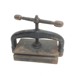 A late 19th century cast iron book press, L48cm, H36cm.