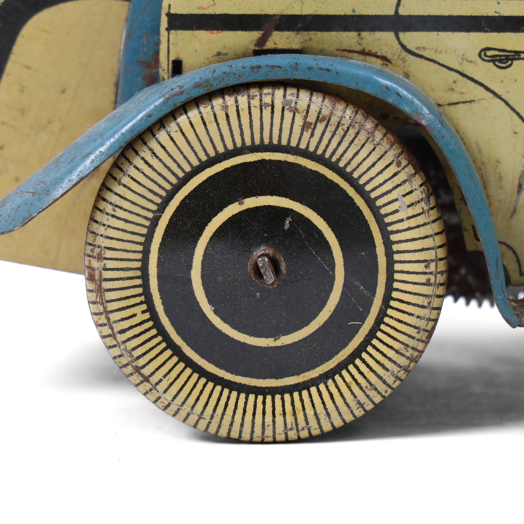 Wells tinplate clockwork limousine, the cream body, with blue roof and lithographed details, with driver and key, H8cm, L23cm