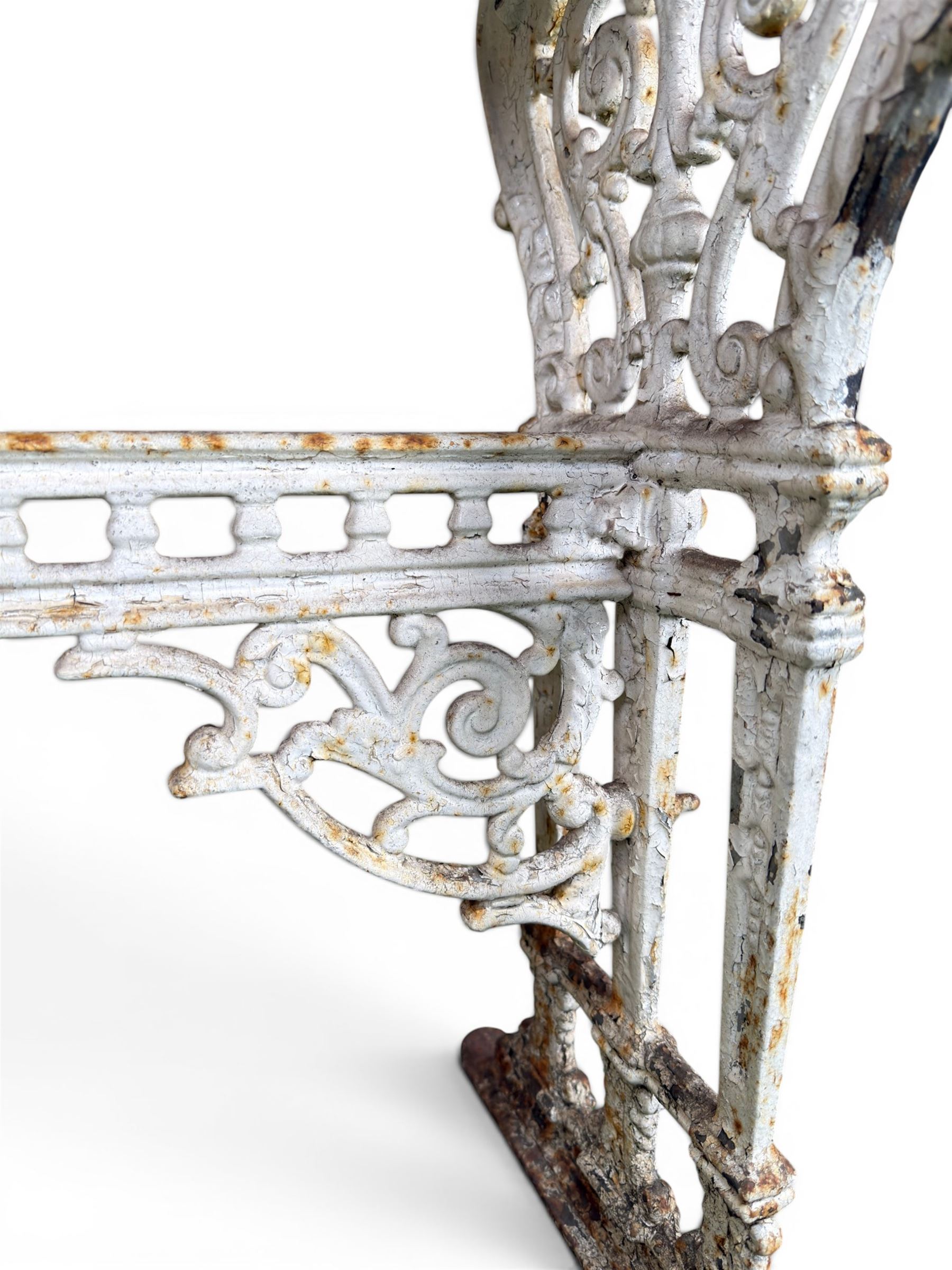 Victorian ornate cast iron garden table, trefoil base with central enclosed column, circular top with later marble, with registration mark
