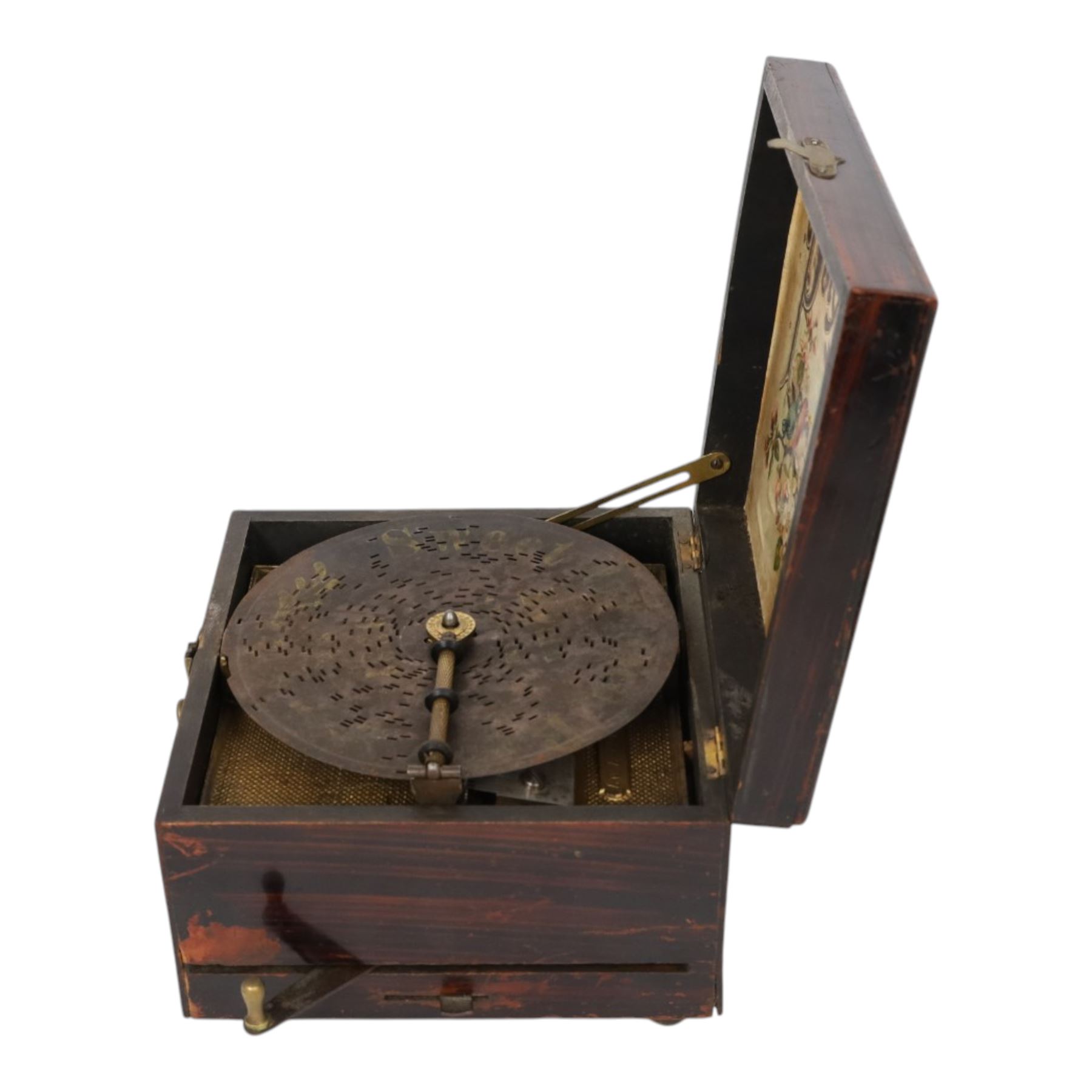 German late 19th century Polyphon, in a mahogany finished case with floral decoration to cover, serial no. 17707, with thirteen discs, H12.5cm, W20cm
