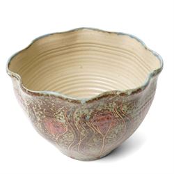 John Egerton (c1945-2024): Stoneware planter, decorated with carved flower motif, mottled blue background and scalloped rim, marked beneath, H18cm
