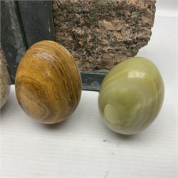 Fossilised coral egg, together with three onyx eggs, mineral bookends and a carved stone