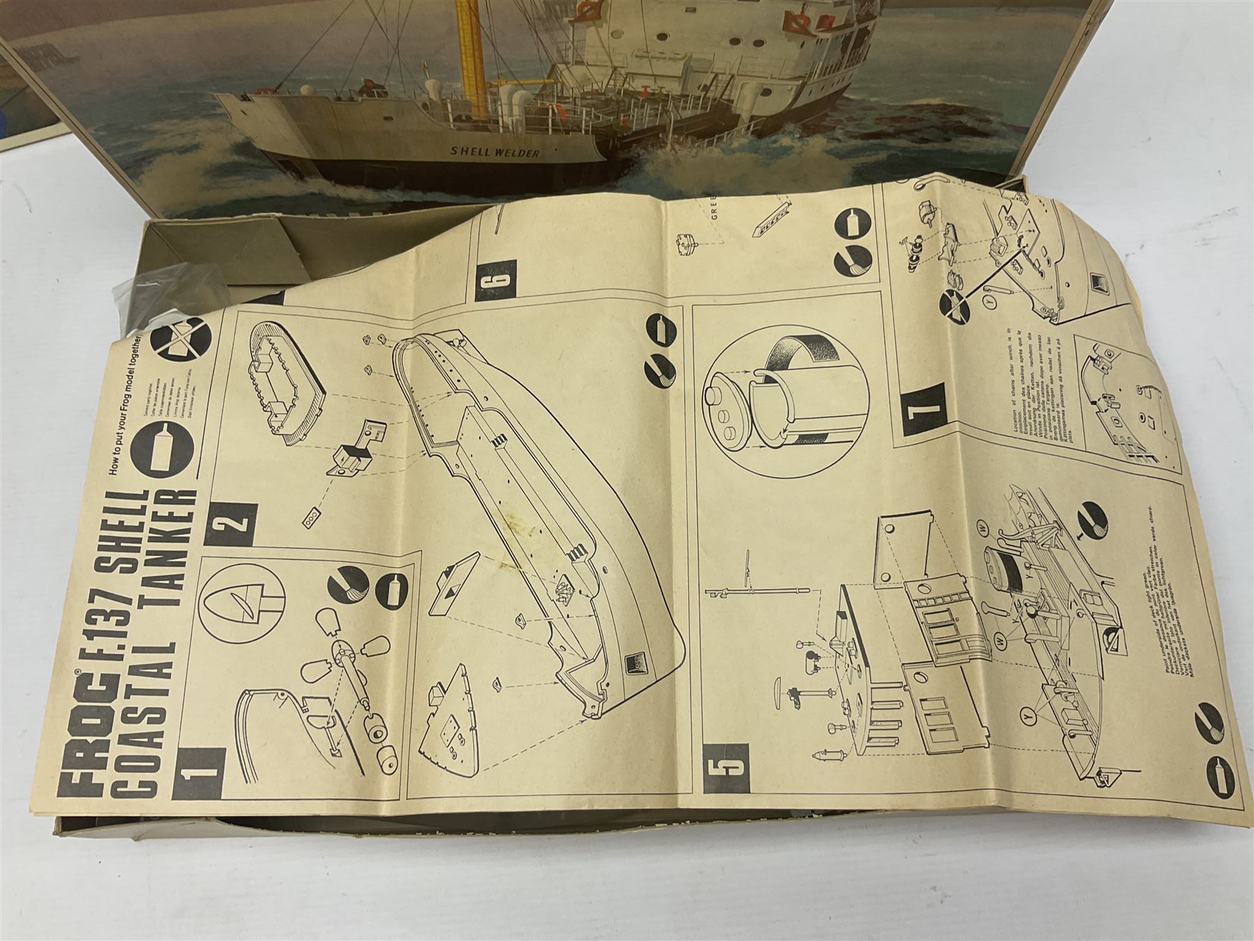 Three unmade construction kits - Airfix 1:24 scale Supermarine Spitfire Mk.1A; predominantly in unopened factory packaging with instructions and decal sheet; Frog Shell Welder with instructions; and Airfix Battle of Waterloo Farmhouse (instructions on box base); all boxed (3)