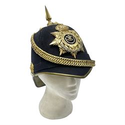 Post-1902 Welsh Regiment Officer's Home Service Blue Cloth Helmet with gilt metal King's crown helmet plate to the front, a removable spike to the top on a shaped cruciform base with rosette fittings, rosette side bosses, brass trim to the front peak, and leather and velvet backed chin scales, with sweat band, the interior with the remains of a makers label at the address 1,3 & 5 Lexington Street, Golden ? London W (presumably Hobson & Sons)