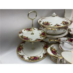 Royal Albert Old Country Roses pattern part tea and dinner service, to include two tureens, eight dinner plates, six side plates, twelve bowls, two mugs, seven teacups and saucers, milk jug,  twelve cake plates, six soup bowls and saucers, candlesticks, etc (95)
