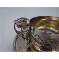 French silver cup and saucer, with embossed floral decoration throughout and openwork floral handle, stamped with Minerva's head and maker's mark for 	P. Fres Paris, cup H5.5cm