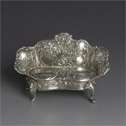 Late 19th/early 20th century German Hanau silver miniature settee, profusely embossed with...