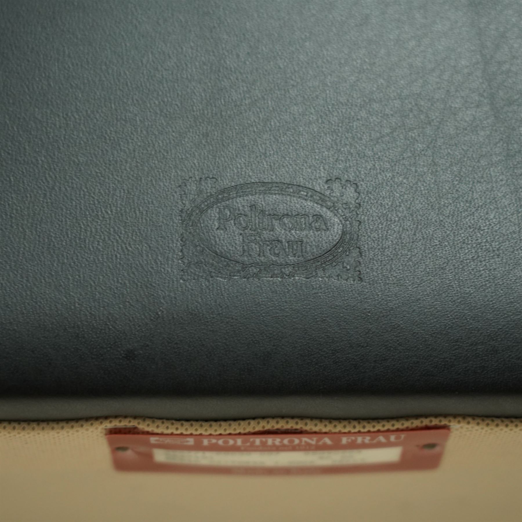 Poltrona Frau - set of eight ‘Vittoria’ dining chairs, each upholstered in black Pelle Frau leather with rolled top-cresting backs and saddle-stitched seams, raised on tapering stained beech supports