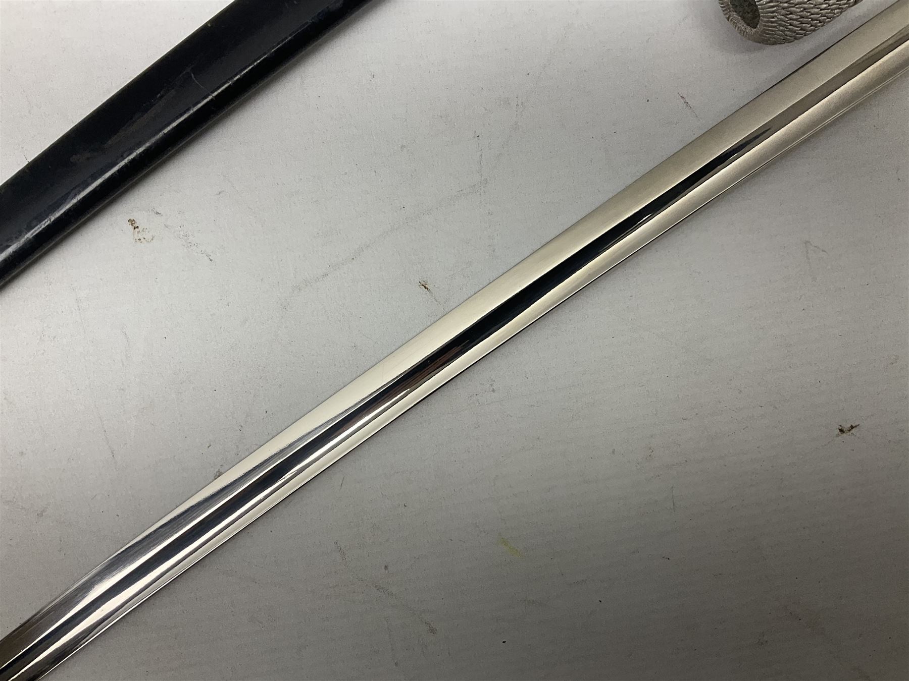 WW2 German Army Prinz Eugen Pattern Officers Dress Sword by Carl Eickhorn, the 80.5cm slightly curving fullered blade with makers name to the ricasso, gilt brass hilt with eagle to the cross-piece and relief of oakleaves to the ferrule, Prinz Eugen style down winged eagle to the pommel of the backstrap; grip retains the original wire binding; in original black painted scabbard with single hanging ring, leather hanger marked 'RZM M5/71 OLC' and silvered knot L97cm overall