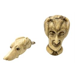 19th century carved ivory walking cane handle, modelled as the head of a greyhound with inset glass eyes, together with a further 19th century ivory example, modelled as a caricature of a gentleman's head, (2)