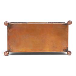 Art and Crafts copper and brass hammered casket, of rectangular form with repoussé decoration of dolphins, in the manner of  John Pearson, H10cm L19cm