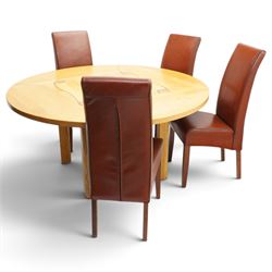 Contemporary round dining table and four orange faux leather chairs