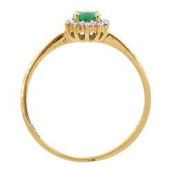18ct gold oval cut emerald and round brilliant cut diamond cluster ring, stamped 750