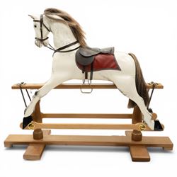 Late 20th century polychrome painted rocking horse, modelled in dapple grey finish with re...