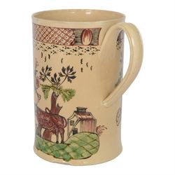 Late 18th century creamware documentary tankard, of cylindrical form with curbed handle, inscribed 'John & Dorothy Stockel 1783', above a floral spray and flanked by a seated female figure to one side, and bull and house to the other, H16.5cm