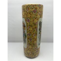 Modern Japanese ceramic umbrella stand, decorated with a figural panel on a yellow floral ground, H60cm