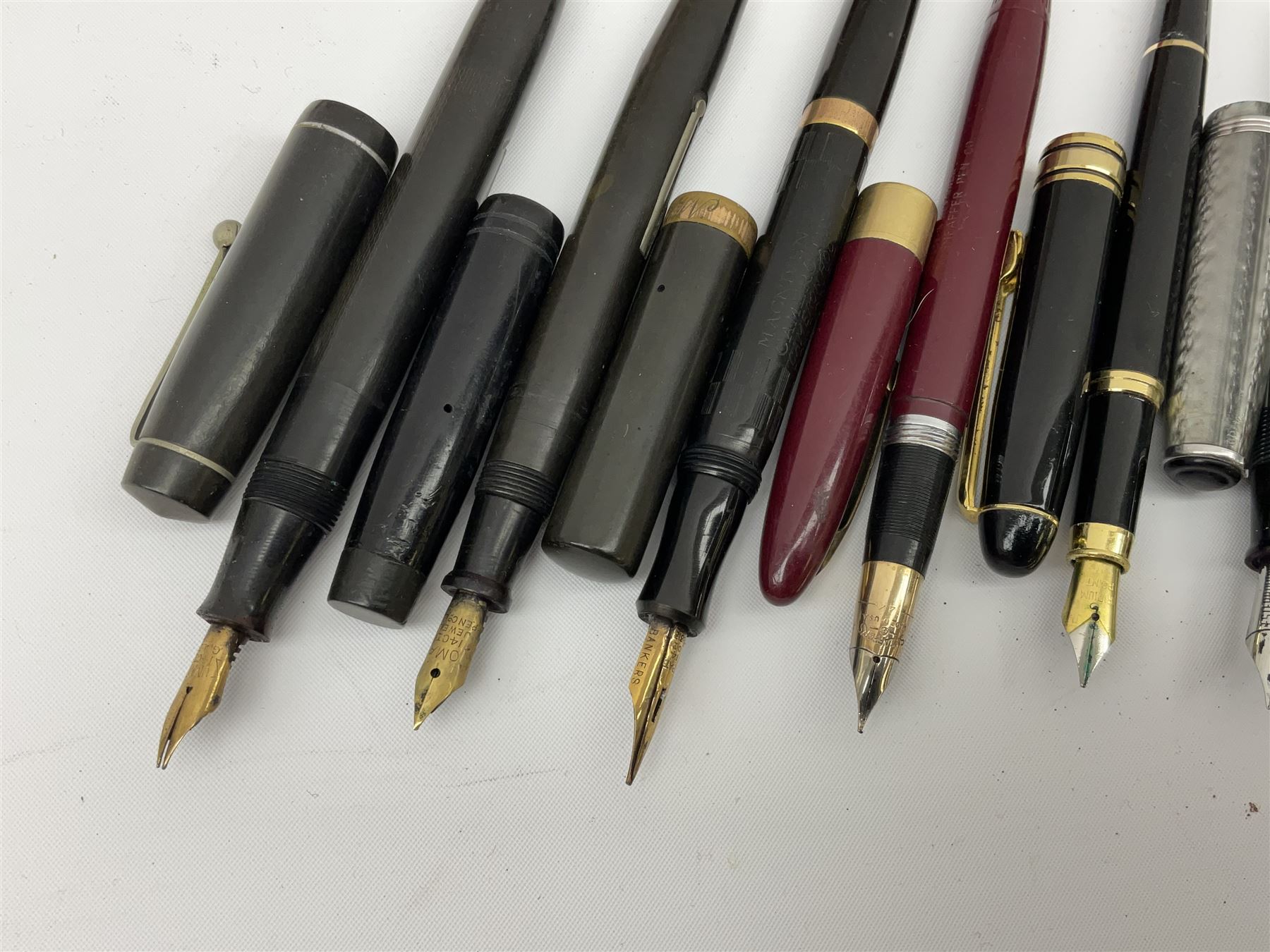 Six fountain pens with gold nibs to include Sheaffer, Macniven & Cameron Ltd and Conway examples, together with four other fountain pens including a boxed Parker pen and a boxed Sheaffer pen in black case with chevron pattern detail