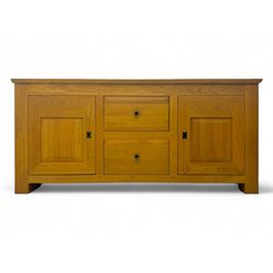 Contemporary light oak sideboard, chamfered rectangular top over two central bevel-edged drawers, flanked by two recessed panelled cupboards enclosing shelving, on square stile supports